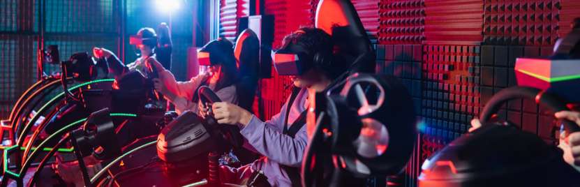  A group of friends playing a VR racing game.