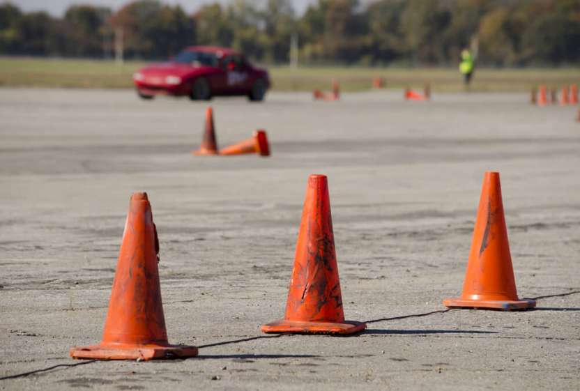 Orange cones set up on an advanced car driving course.