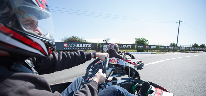 two men racing on track supporting image